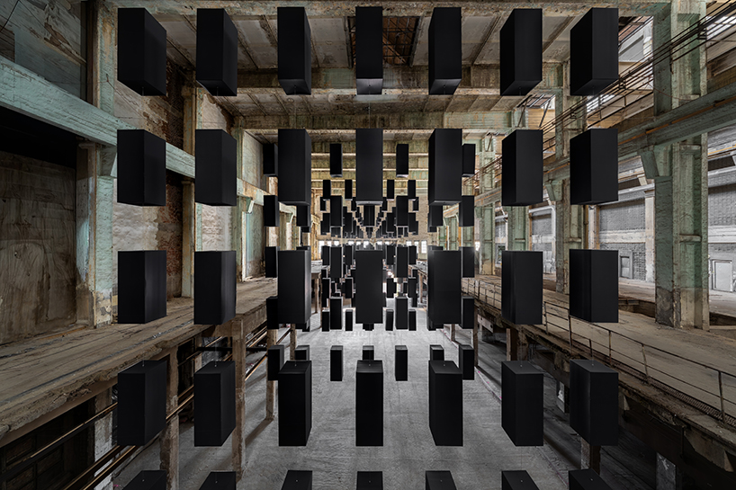 SpY's suspended grid installation of black rectangles floats within turbine factory in hungary