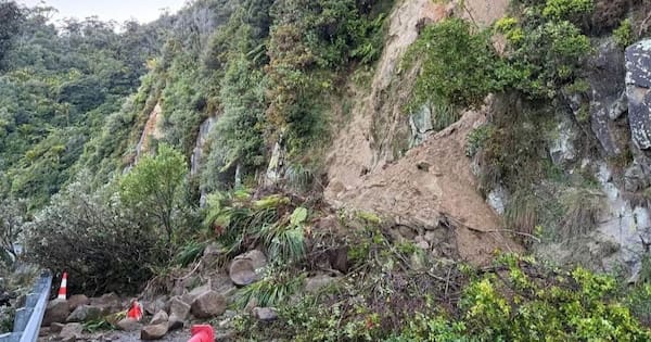 Slip closes West Coast highway, heavy downpours for lower North