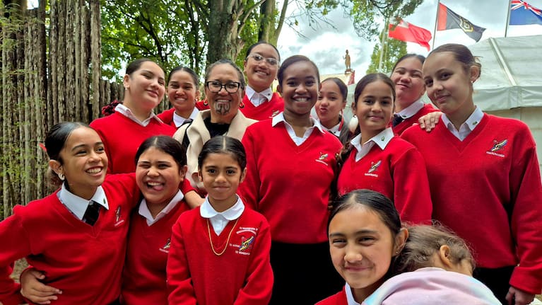 Students and a teacher from Te Wharekura o Rakaumanga in Huntly, where Te Arikinui Kuini Nga wai hono i te po went to school.