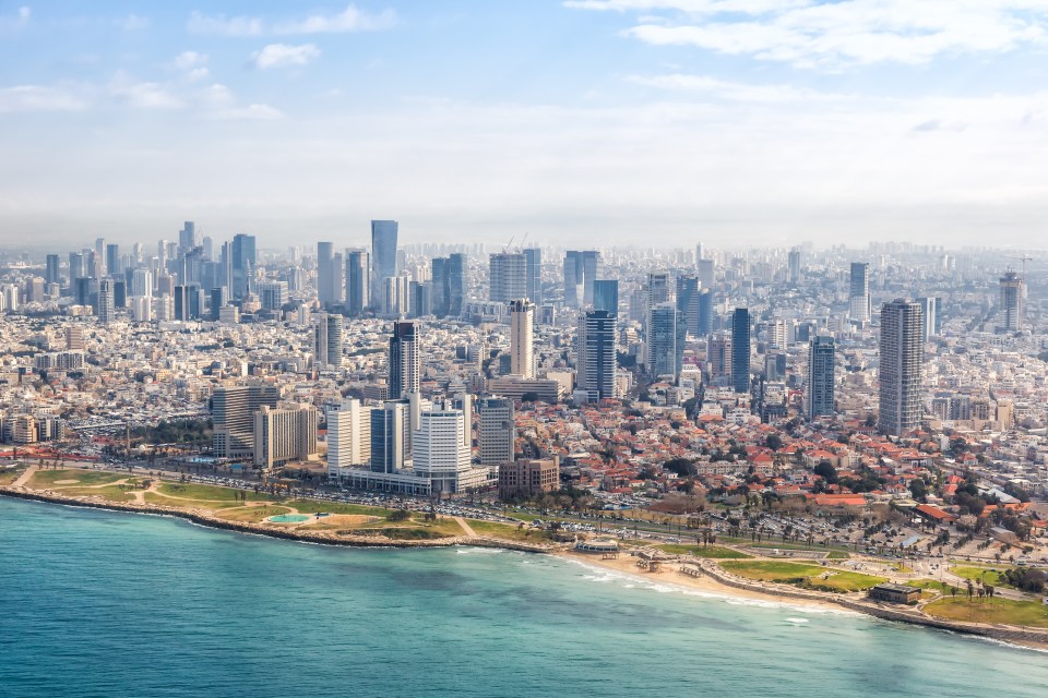 Aerial view of Tel Aviv skyline and beach.