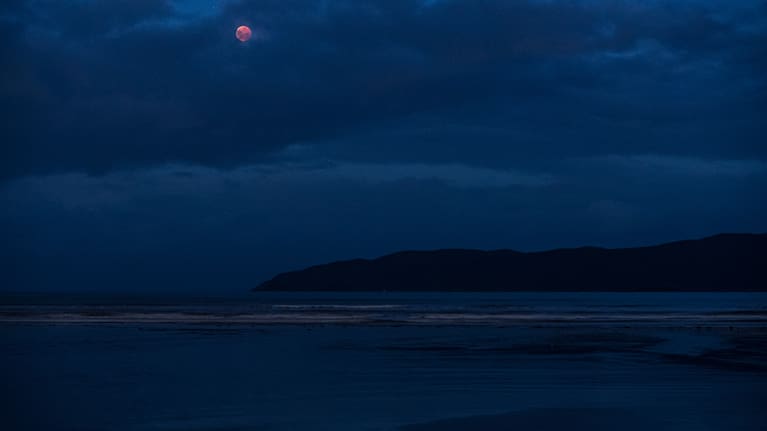 The blood moon visible from Paraparaumu Beach.