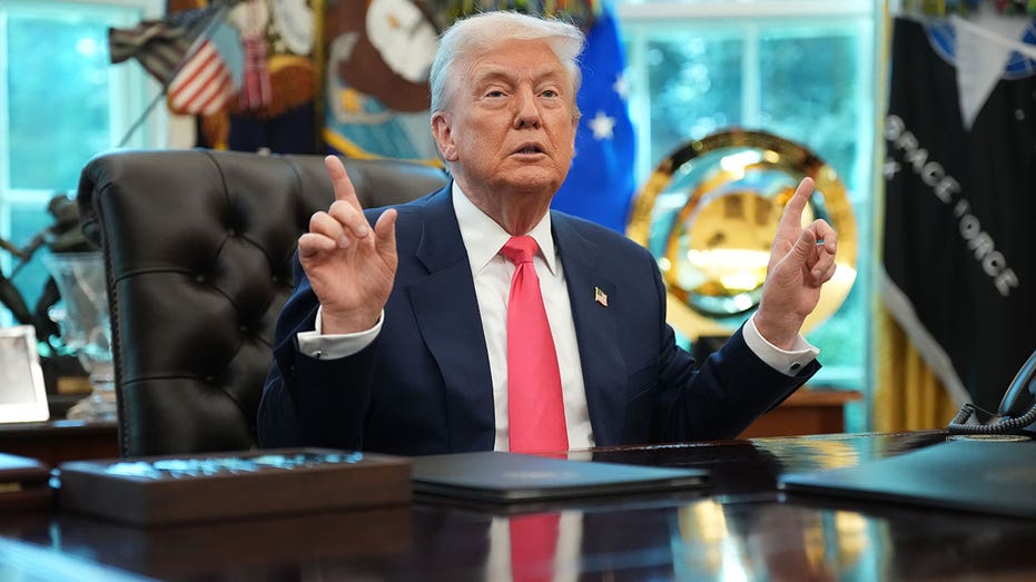 Trump answers questions from reporters in the Oval Office on August 14, 2025 in Washington, D.C.