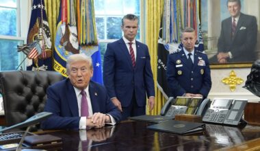 President Donald Trump speaks in the Oval Office of the White House, Friday, Sept. 5, 2025, in Washington, as Defense Secretary Pete Hegseth and Chairman of the Joint Chiefs of Staff Gen. Dan Caine listen. (AP Photo/Alex Brandon)