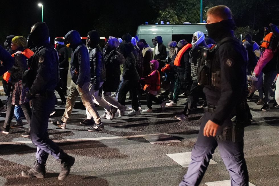 \u200bFrench riot police blocked off the migrants from reaching a small boat