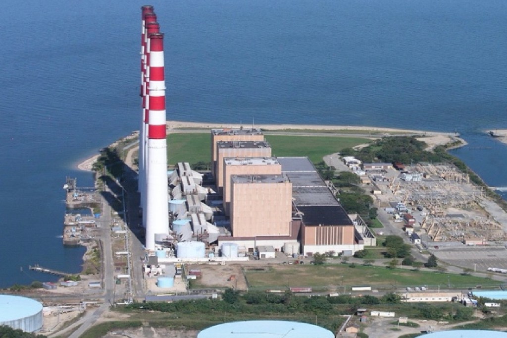 Aerial view of the Northport Power Station on a peninsula next to a body of water.