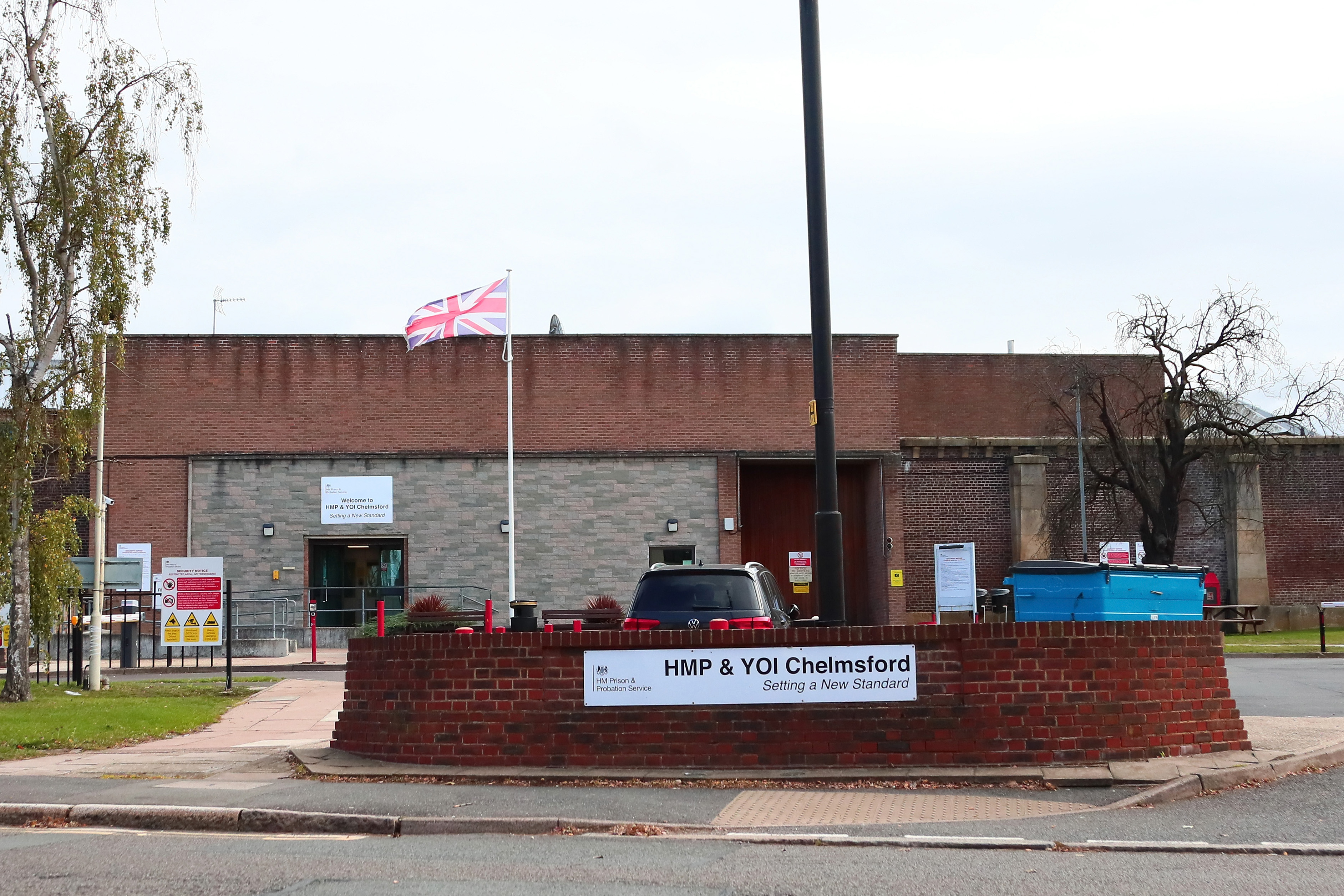 Exterior view of HMP Chelmsford with a Union Jack flag flying on a pole.