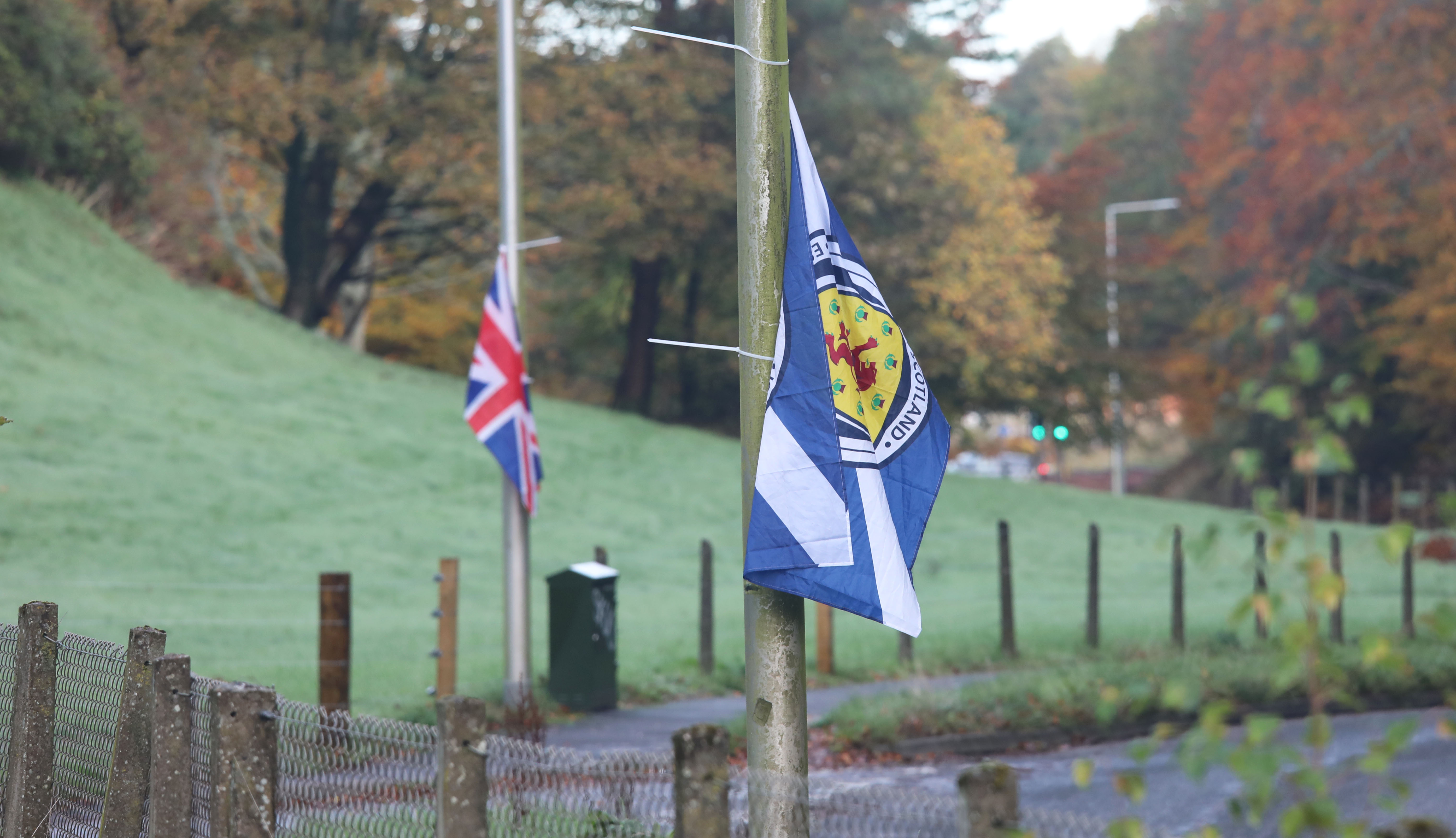 Saltire and Union Jack flags tied to lampposts at Cameron Barracks, where asylum seekers will be housed.