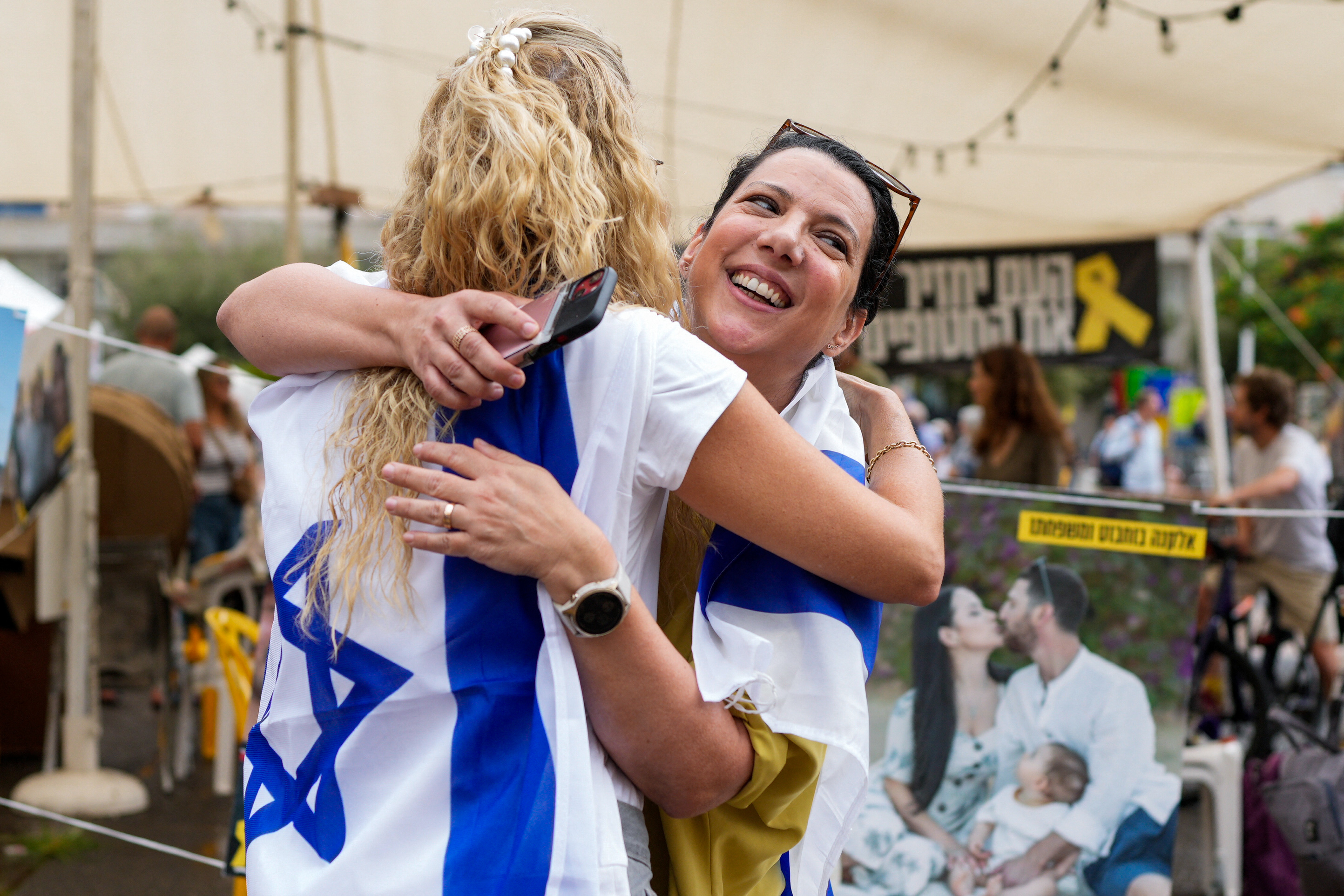 Israelis react at Hostage Square in Tel Aviv on Thursday