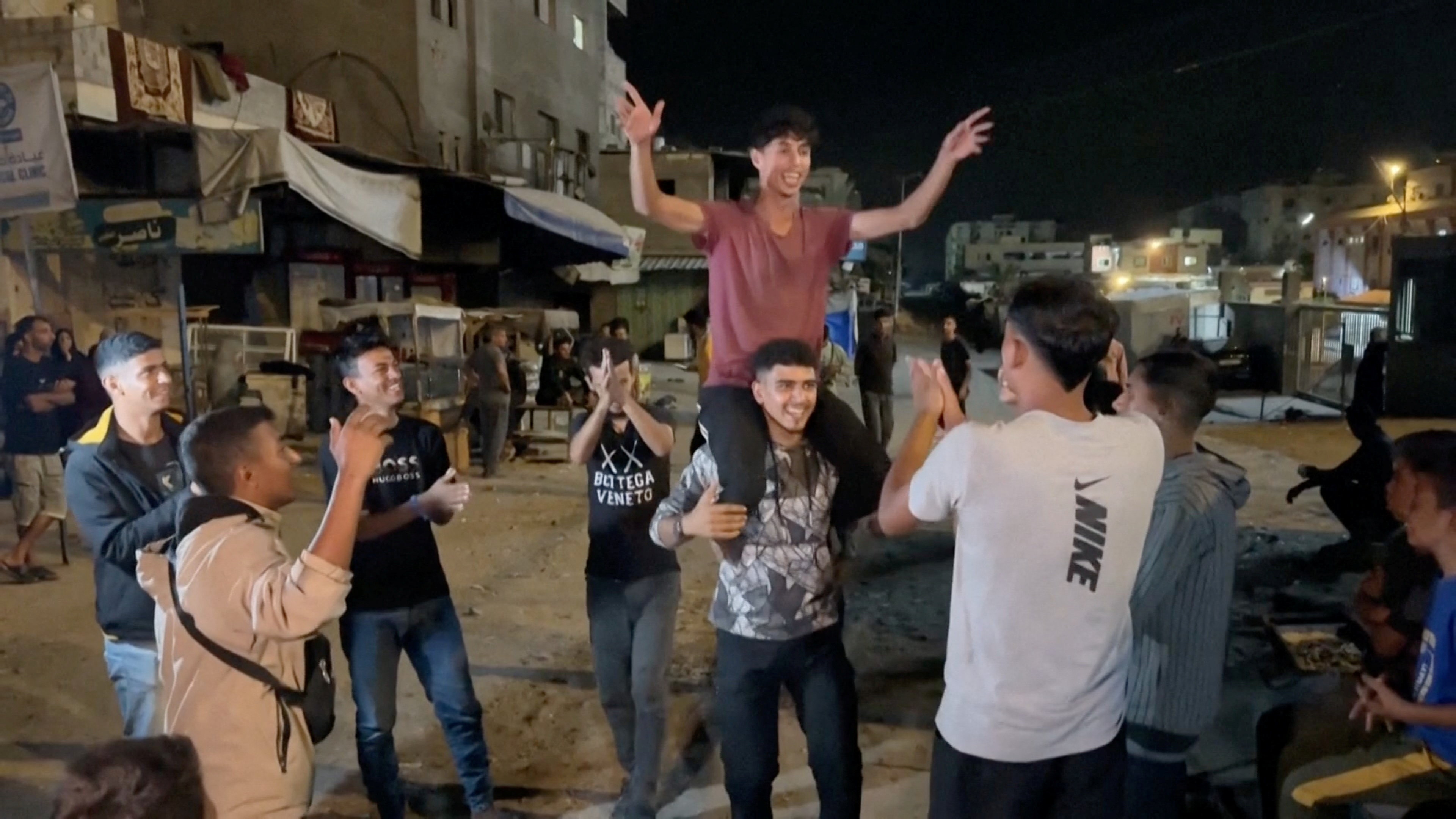 Palestinians celebrate in Khan Younis in the southern Gaza Strip