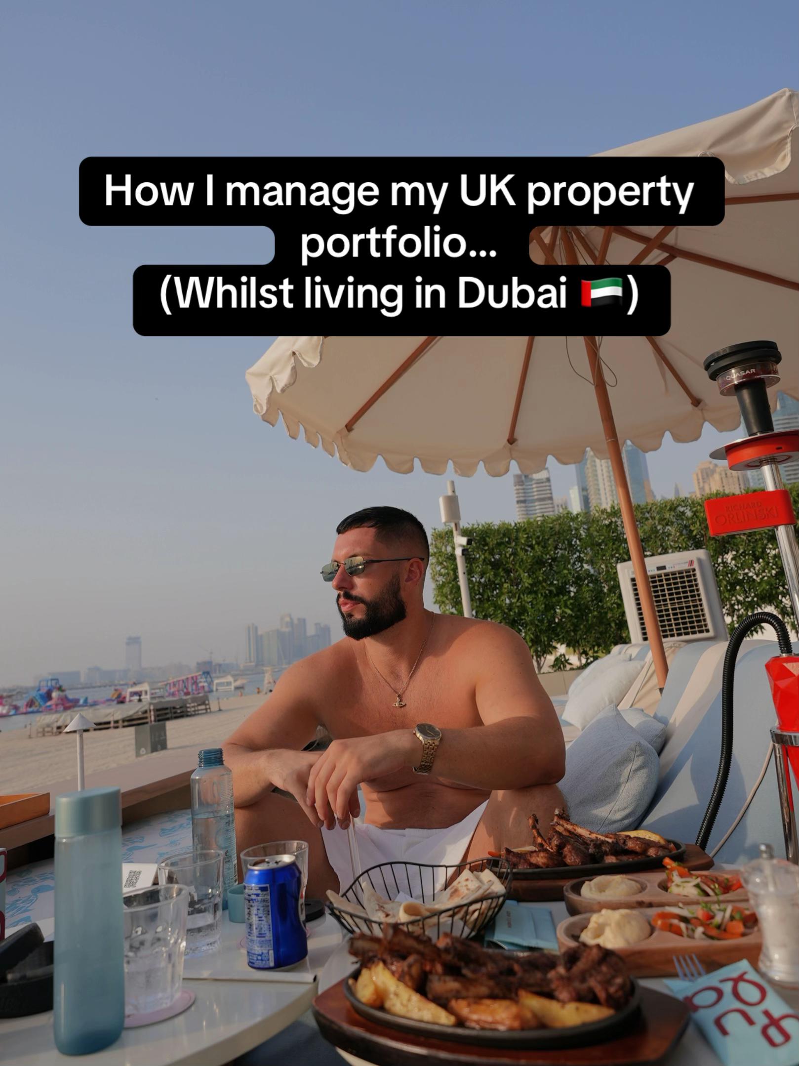 Luigi Newton seated at a table with food, with a speech bubble above his head reading "How I manage my UK property portfolio... (Whilst living in Dubai)".