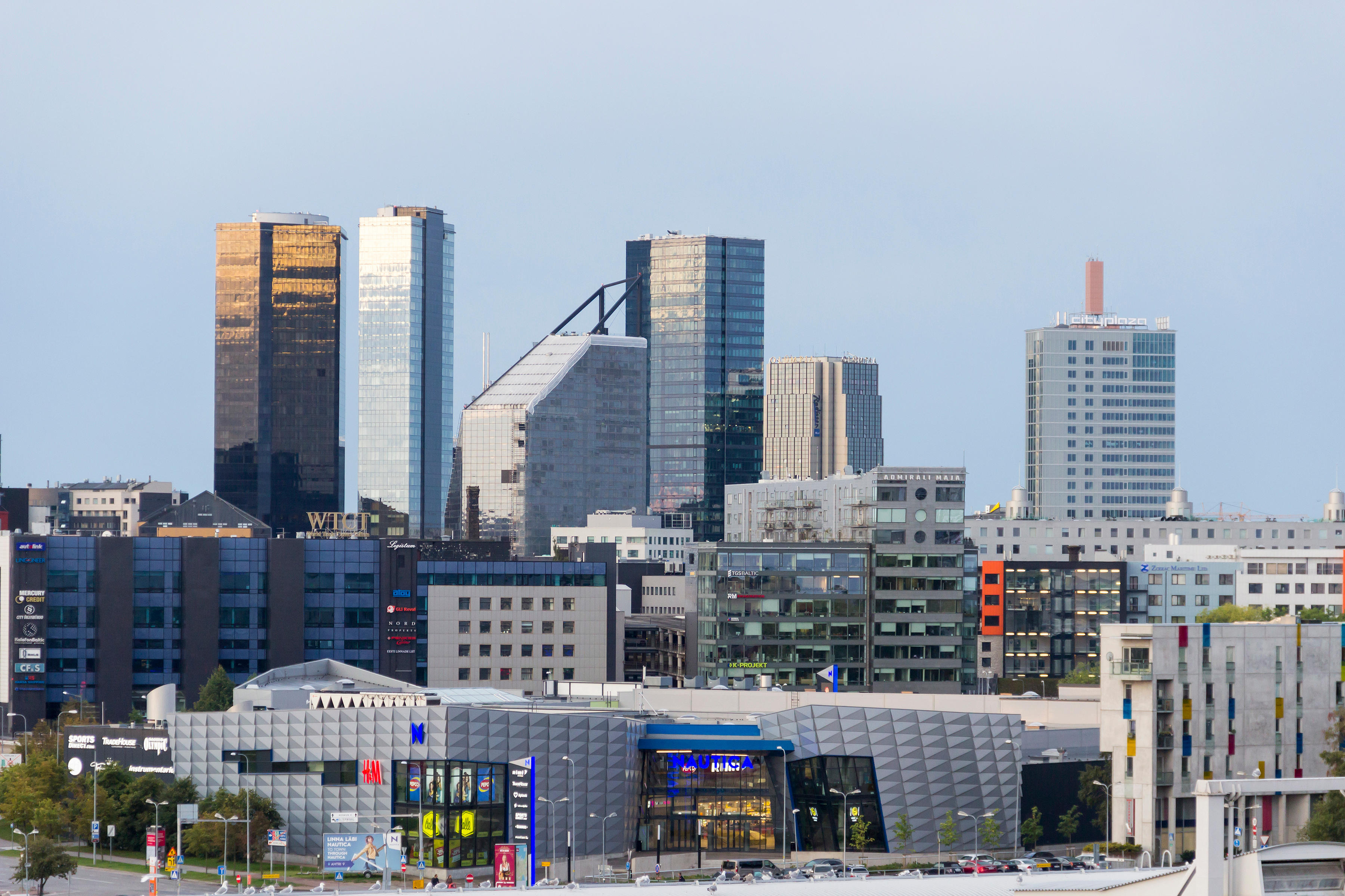 Tallinn modern skyline with skyscrapers, business buildings, and a shopping mall.
