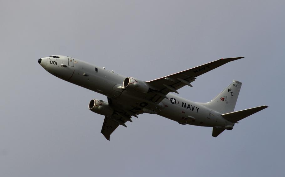 An aircraft is seen from below.