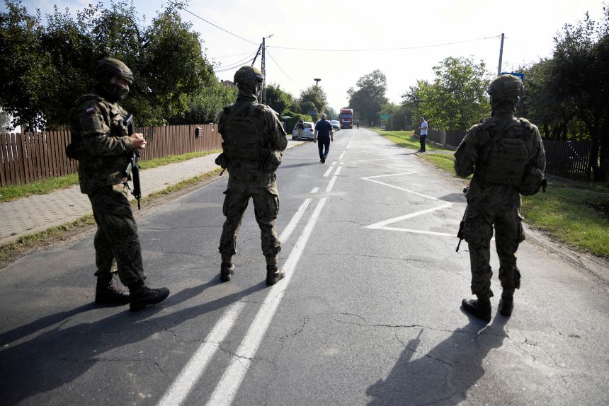 Soldiers patrol the street after a drone struck a residential building, following violations of Polish airspace during a Russian attack on Ukraine, in Wyryki municipality, Poland, on September 10, 2025.