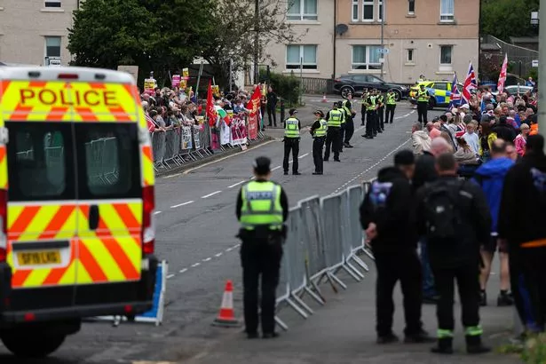 Anti-migrant protesters demonstrate outside the Cladhan Hotel in Falkirk