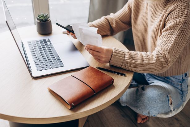 Woman reading energy bill