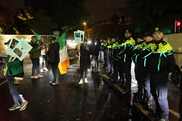Gardai form a cordon across the entrance to Citywest Hotel, Saggart tonight as a small group of protesters remonstrate after an earlier alleged incident .....Picture Colin Keegan, Collins, Dublin.