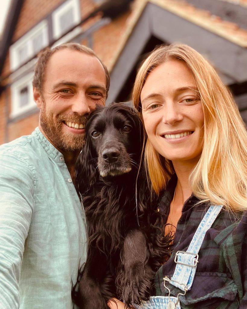 james middleton taking selfie in front of house with wife and dog