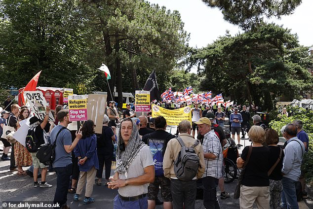 Pro-migrant activists face off against anti-immigration protesters during a tense rally in Bournemouth on August 9, 2925