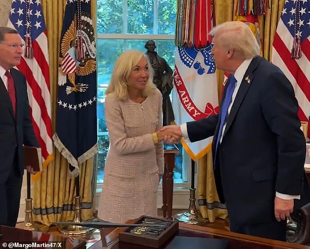 President Donald Trump (right) was seen in video footage Friday posted by longtime aide Margo Martin at the conclusion of a swearing-in ceremony for U.S.'s ambassador to Sweden, Christine Toretti (center). He's held no public events since Tuesday
