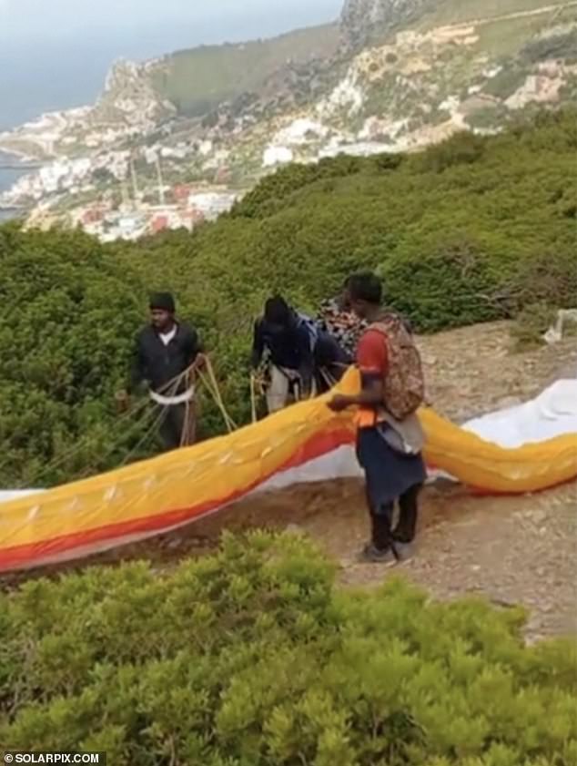 The illegal arrival managed to escape, leaving behind the multi-coloured paragliding gear he had used