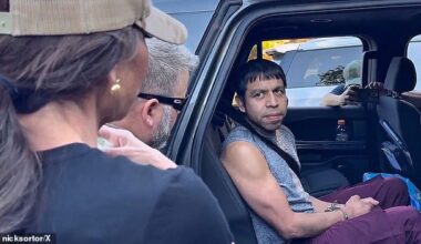 The smiling man appeared to ask Noem to 'let me out' in the footage, filmed by conservative commentator Nick Sortor , but translators have since argued he was actually noting he had 'seen her on the tele[vision]'