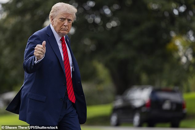 Donald Trump returns to the Oval Office from Marine One on the South Lawn of the White House in Washington, DC, on Friday