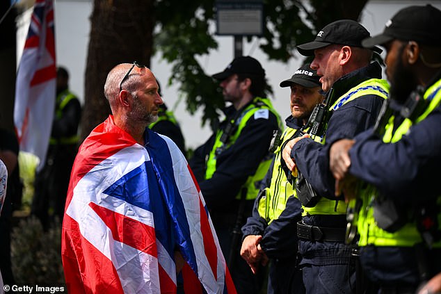 Anti-migrant protester at a demonstration on August 9, 2025, outside one of the hotels in Bournemouth being used to house asylum seekers