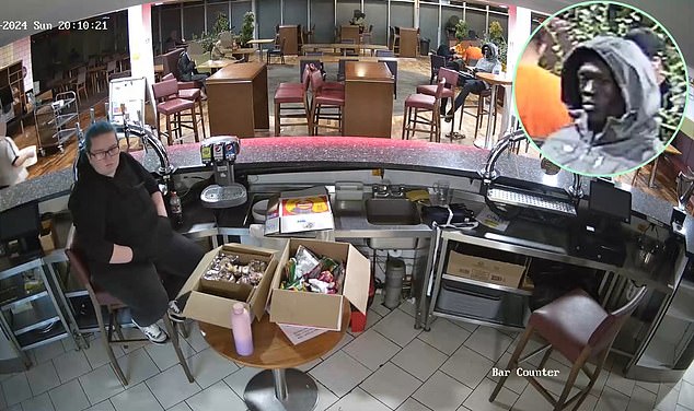 Rhiannon Whyte can be seen sitting behind the bar in the hotel while a man alleged to be the defendant fixes his gaze on her from a few metres away