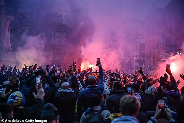 The Israeli fans, pictured last November in Amsterdam, have been asked by West Midlands Police to stay away from the fixture at Villa Park in Birmingham
