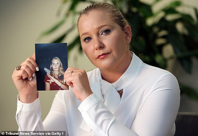 Ms Giuffre holds a photo of herself at 16 - when she first met Jeffrey Epstein. She took her own life in April, aged 41