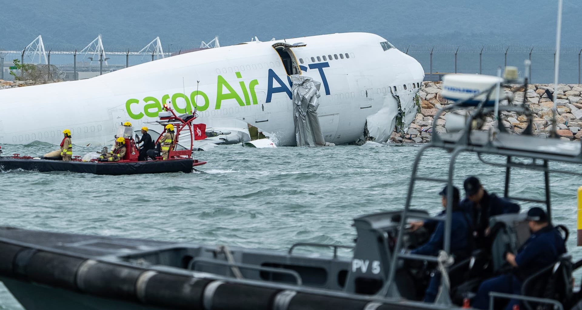 Cargo plane slides off runway falls into sea in Hong Kong
