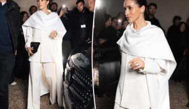 Meghan Markle bursts into laughing fit among stoic crowd at Fashion Week show