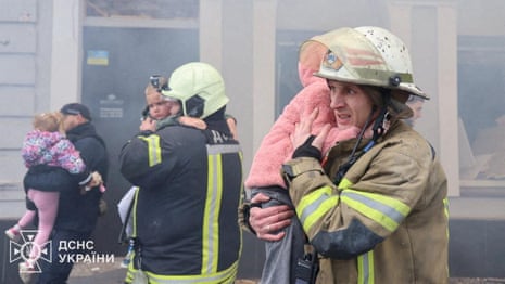 Ukraine kindergarten among civilian sites hit by Russian drone and missile strikes – video
