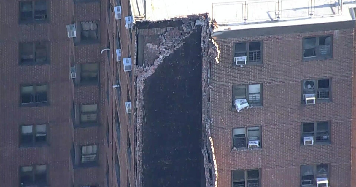 Bronx high-rise partially collapses after explosion. Video shows entire side of 20-story building gone.