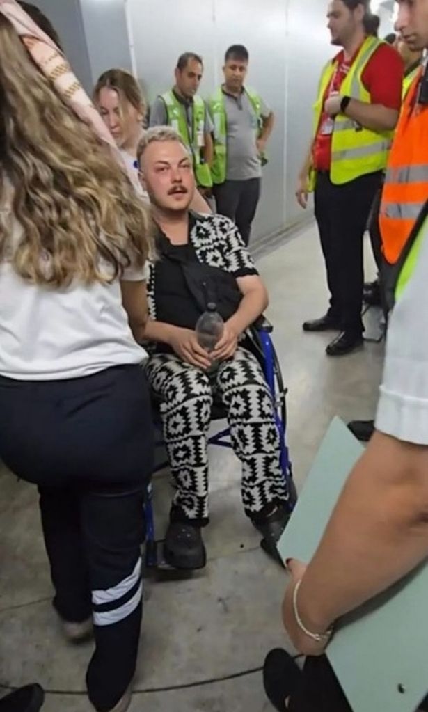 Dan as he's helped off the plane 