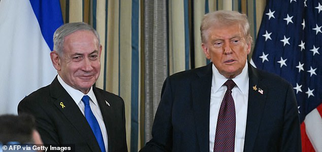 (FILES) US President Donald Trump and Israeli Prime Minister Benjamin Netanyahu shake hands at the conclusion of a joint press conference in the State Dining Room of the White House in Washington, DC on September 29, 2025. US President Donald Trump said on October 8, 2025 that Israel and Hamas had agreed on the first phase of his Gaza peace plan, hailing it as a "historic and unprecedented" step to ending the two-year-old war. Palestinian militant group Hamas would release all hostages while Israel would pull its troops back to an agreed on line, Trump said after talks in Egypt on his 20-point peace plan resulted in a deal. (Photo by ANDREW CABALLERO-REYNOLDS / AFP) (Photo by ANDREW CABALLERO-REYNOLDS/AFP via Getty Images)
