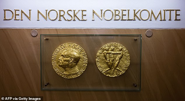 (FILES) A photo taken on September 25, 2024 in Oslo, Norway shows replicas of the obverse and reverse of the Nobel Peace Prize medal displayed at The Norwegian Nobel Institute. The winner of the Nobel Peace Prize will be announced in Oslo on October 10, 2025. (Photo by Jonathan NACKSTRAND / AFP) (Photo by JONATHAN NACKSTRAND/AFP via Getty Images)