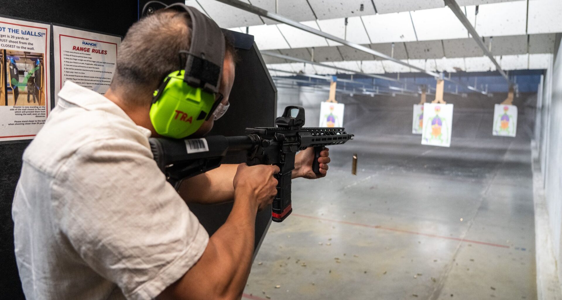 Kristian Frandsen of Denmark shoots an AR-15–style rifle at The Range at Austin as he visits for Formula 1, Friday, Oct. 17, 2025.