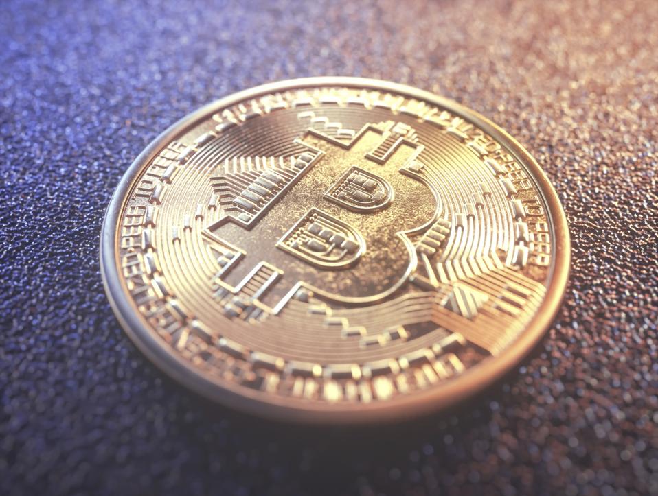 An illustration of a physical unit of cryptocurrency bitcoin 