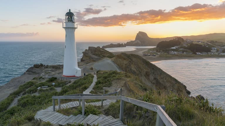 Castlepoint lighthouse and Castle Rock at sunset, Castlepoint, Wairarapa region, North Island, New Zealand.