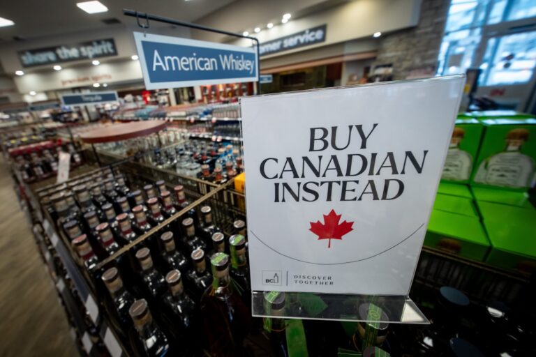 A sign in front of the American whiskey section at a Vancouver liquor store after American-made products were removed from shelves in February 2025.