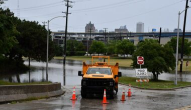 A Department of Public Works vehicle blocks traffic into the flooded Menomonee Valley on Aug. 10. Photo by Jeramey Jannene.