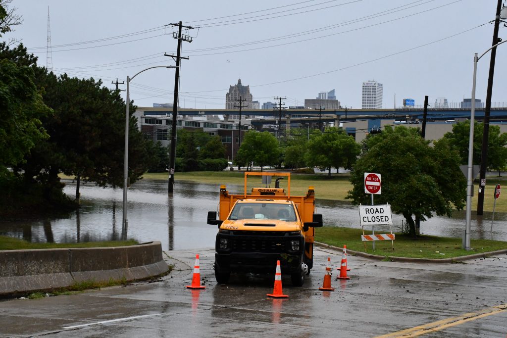 A Department of Public Works vehicle blocks traffic into the flooded Menomonee Valley on Aug. 10. Photo by Jeramey Jannene.