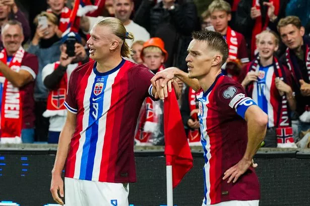 Norway's forward Erling Braut Haaland (L) and celebrates the 3-0 goal with Norway's midfielder Martin Ødegaard during the 2026 World Cup qualifiers Europe zone group I football match between Norway and Moldova