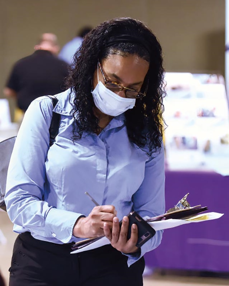 photo of a woman filling out a job application