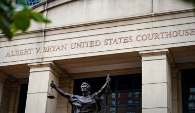 Fired federal prosecutor tapes a note about duty to the door on his way out