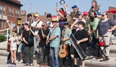 Local musicians rock downtown by Takin' Care of Business