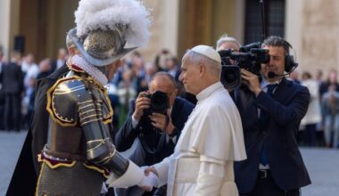 On the Feast of St. Francis of Assisi, 27 new Swiss Guards took their oath of allegiance in the presence of Pope Leo XIV, shown greeting a Swiss Guard. This marks the first time a pope has participated in the ceremony since Pope Paul VI in 1968.