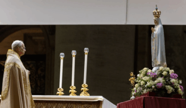 Pope Leo XIV stands before the original Our Lady of Fatima statue at a Marian vigil in St. Peter's Square, Rome, Saturday, Oct. 11, 2025.