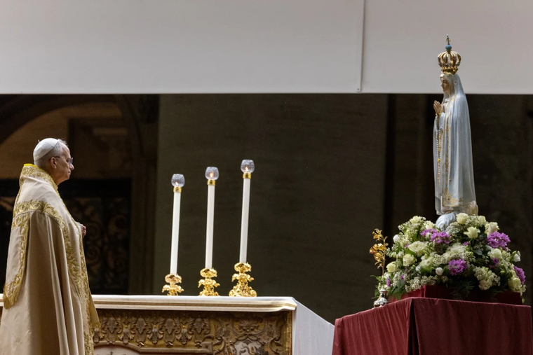 Pope Leo XIV stands before the original Our Lady of Fatima statue at a Marian vigil in St. Peter's Square, Rome, Saturday, Oct. 11, 2025.